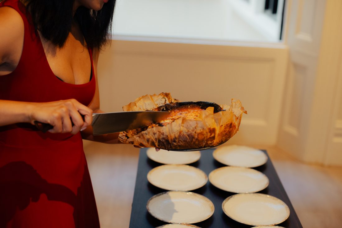 Slicing the burnt Basque cheesecake