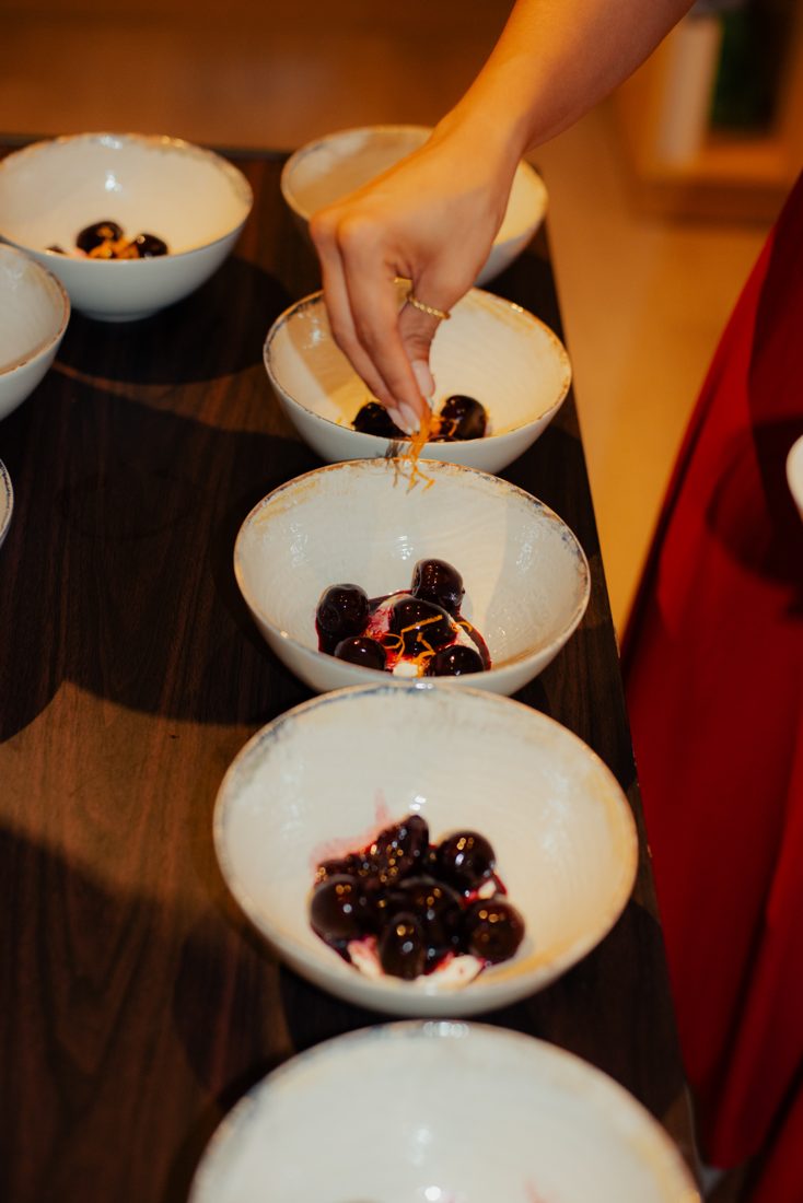 Cherries in rioja syrup being served
