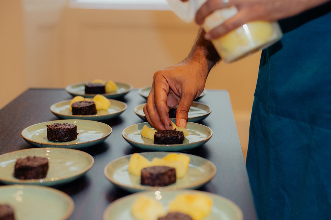 A row of plates being finished
