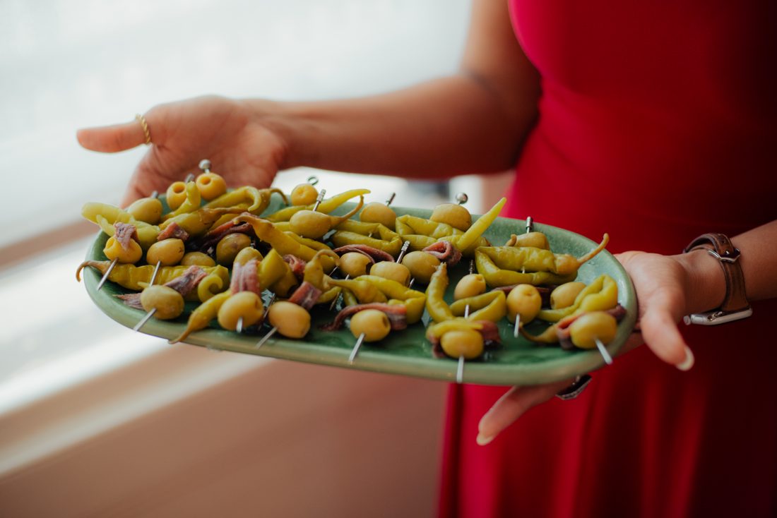 Ankita carrying a platter of padron peppers