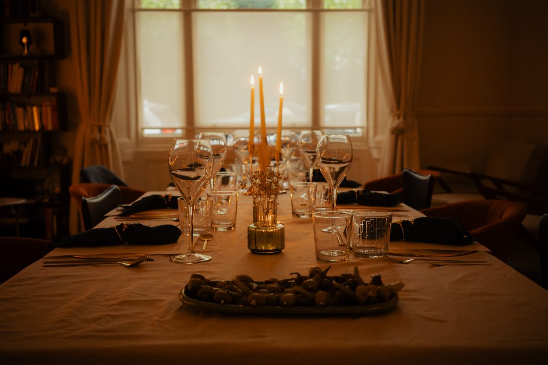 The candlelit table laid for dinner